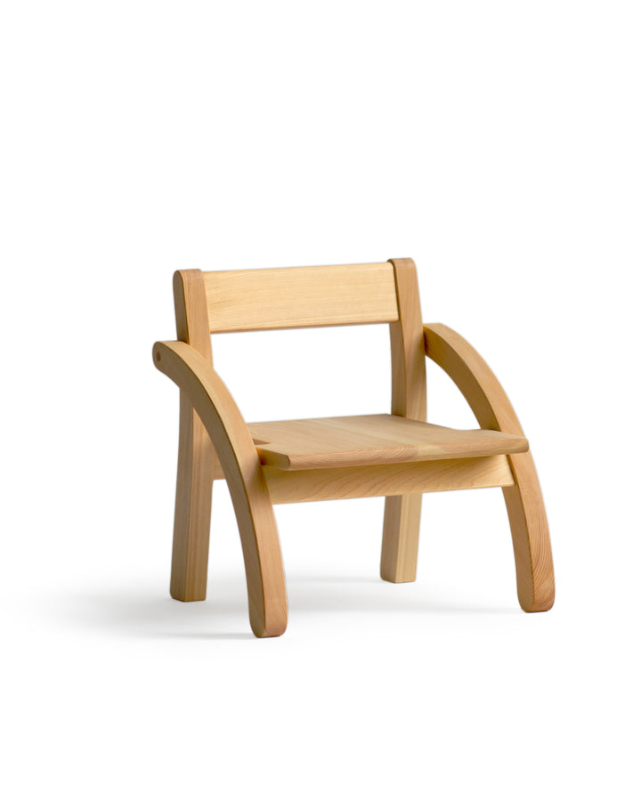 Silhouetted image of 1 year old school chair against white background at an angle.