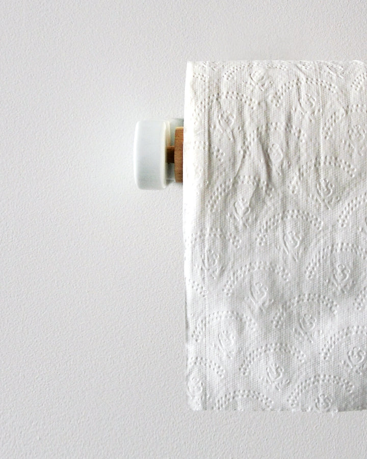 White porcelain and wood toilet paper roll holder by Makoto Koizumi