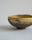 Cropped detail image of the exterior of the Gold Chawan VII.