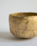 Cropped detail image of the exterior of the Gold Chawan VI.