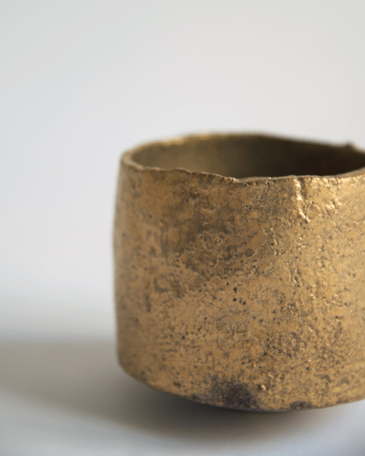 Cropped detail image of the exterior of the Gold Chawan X.