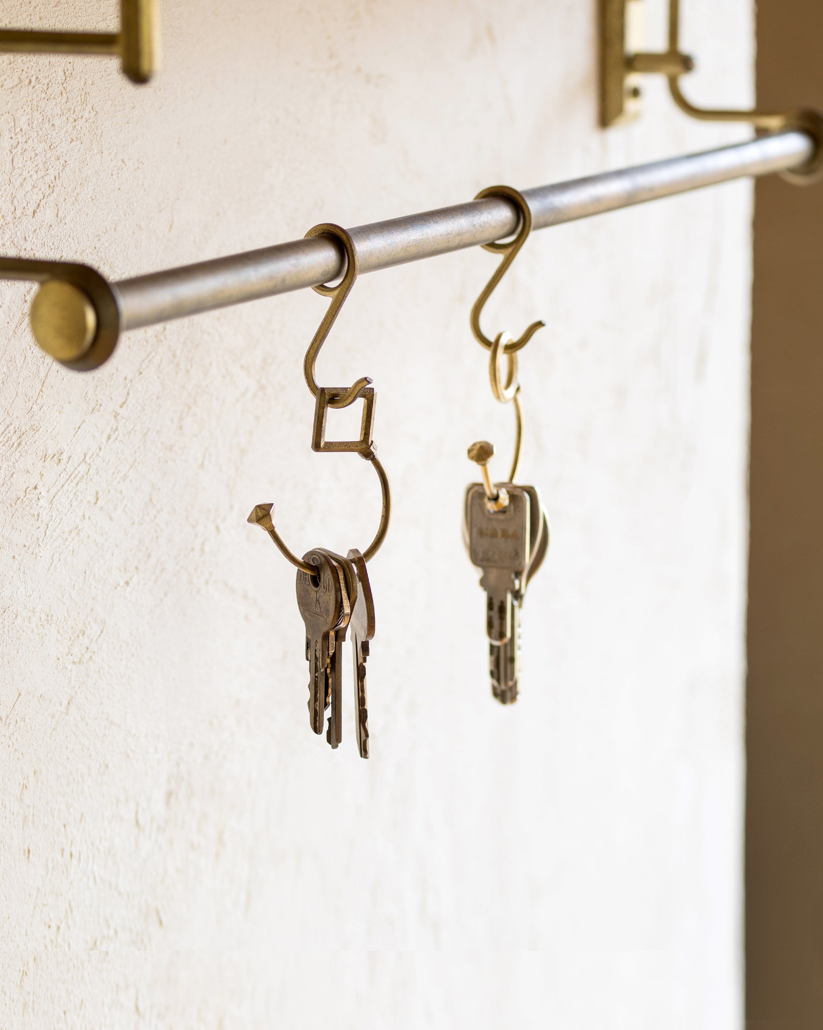 Matureware brass pipe s hooks with keys hanging on hooks