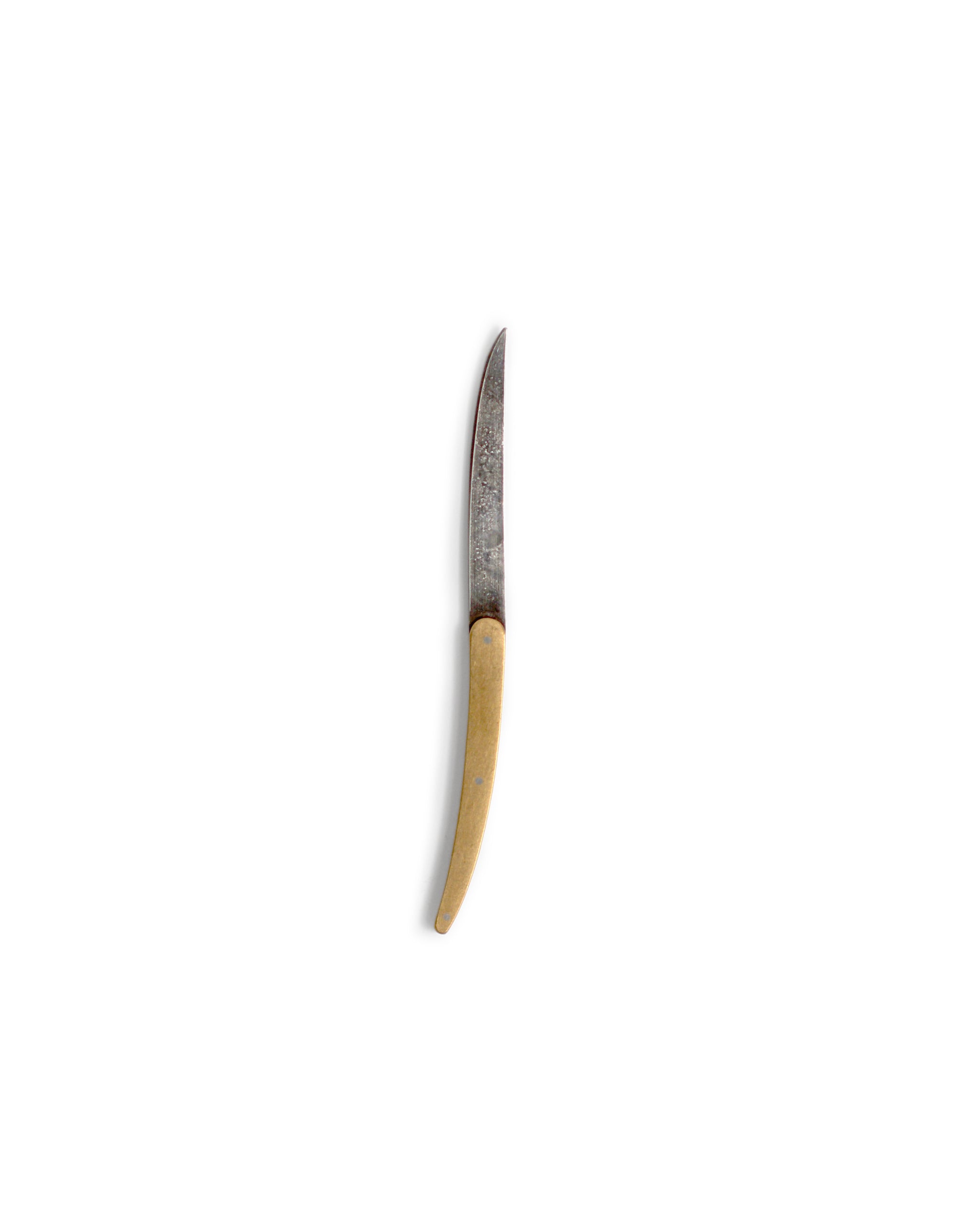 Wagashi knife silhouetted against white background.