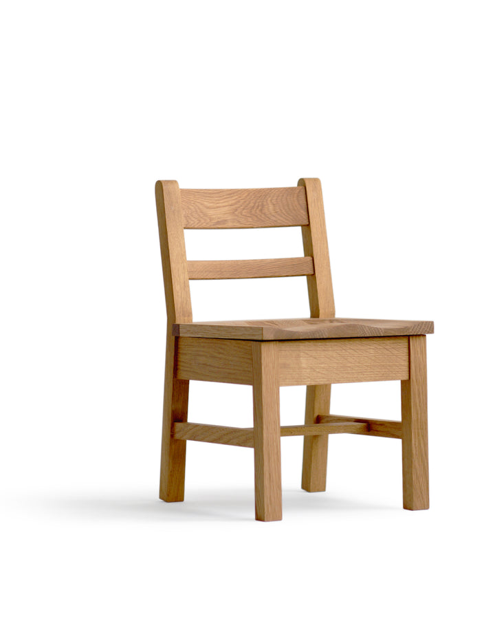 Silhouetted image of the Keepsake Kids Chair against white background at an angle.