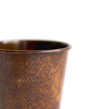 Detailed cropped image of brown urushi wood cup.