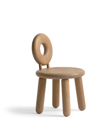 Bialy Children's Chair on a white background at an angle. Designed by Pat Kim.