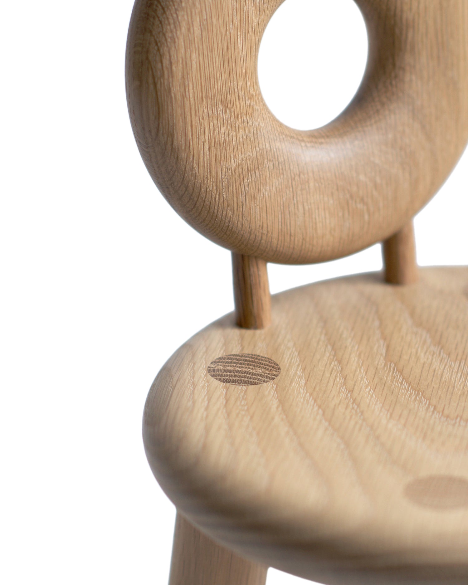 Detailed image of the bialy children's chair, showing details of the wood joinery. Designed by Pat Kim.