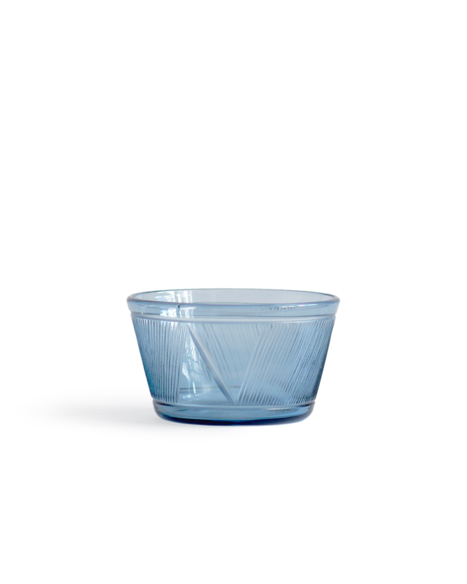 Silhouetted small reclaimed blue square bowl against white background.