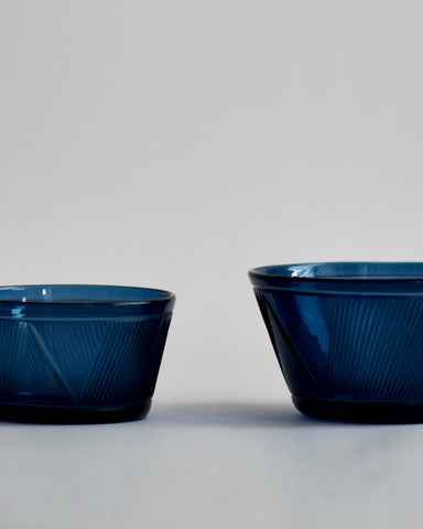 Cropped detail of the small and large reclaimed blue bowl next to each other. featuring signature 'Factory Zoomer x Nalata Nalata' cut glass pattern.