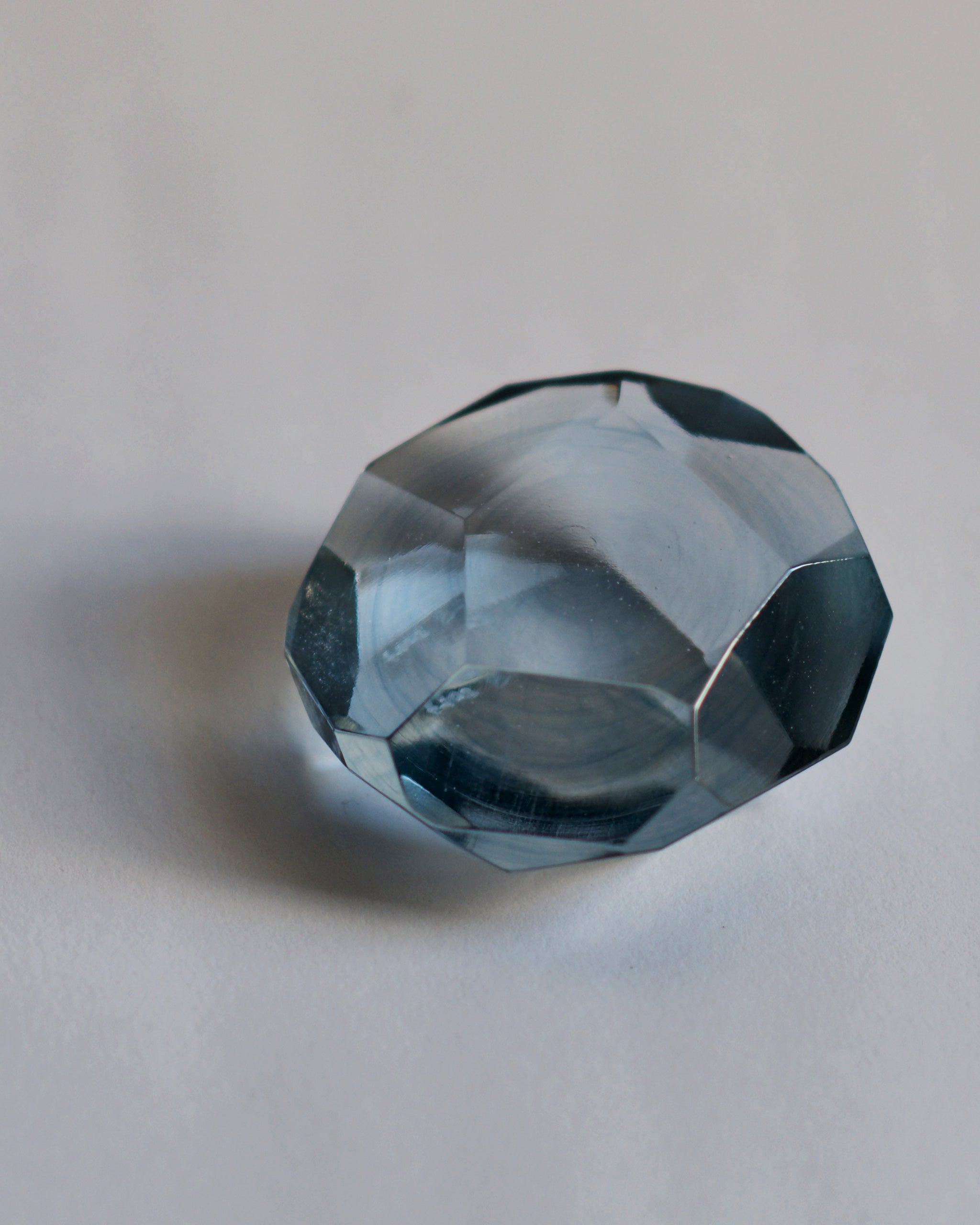 Detail of the light  blue reclaimed blue jewelry cut paperweight.