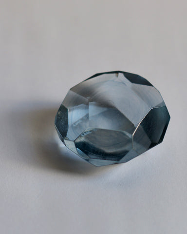 Detail of the light  blue reclaimed blue jewelry cut paperweight.