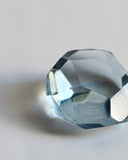 Cropped detail of the light blue reclaimed blue jewelry cut paperweight.