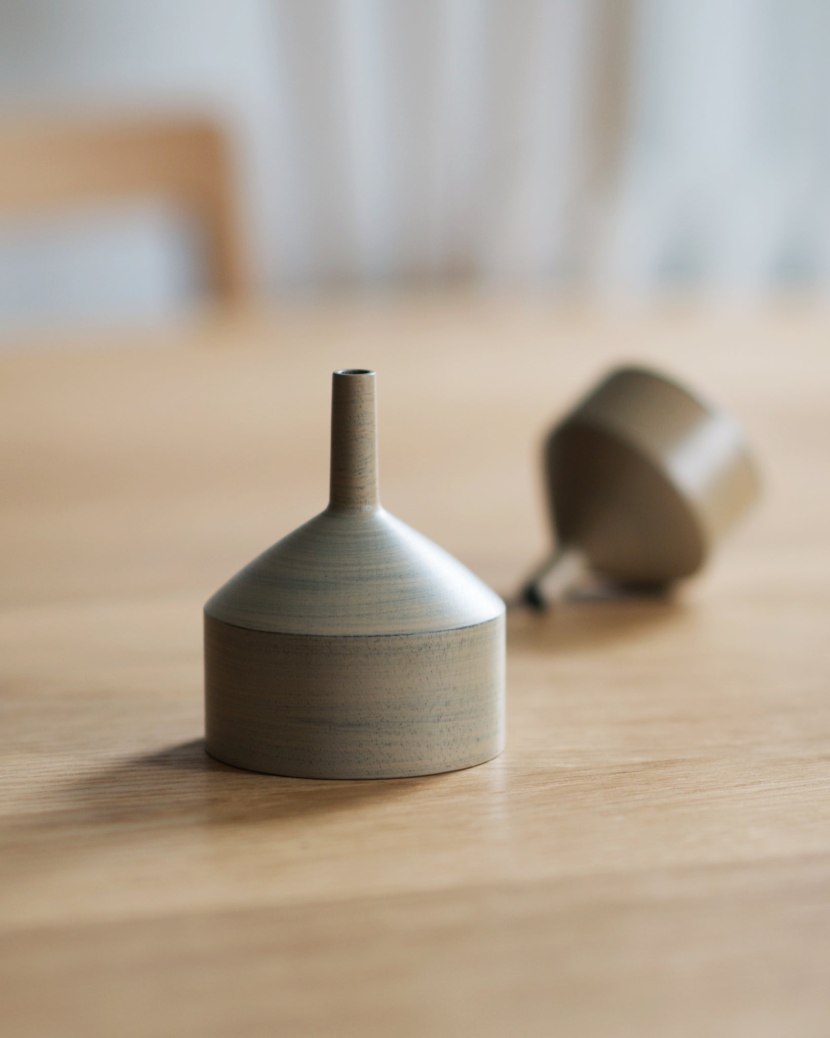Ryuji Mitani Wooden Urushi Funnel Large and Small on a table