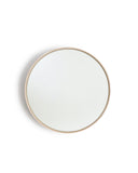 White Oak Wood Round Mirror by Saito Wood Co for Nalata Nalata silhouetted hanging against white