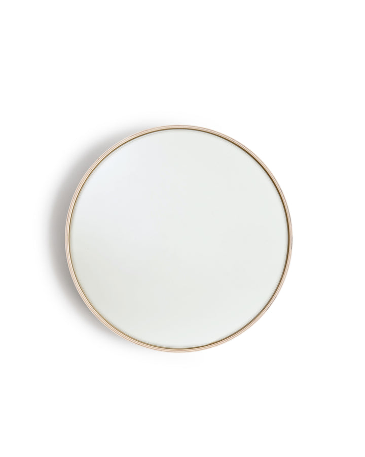 White Oak Wood Round Mirror by Saito Wood Co for Nalata Nalata silhouetted hanging against white