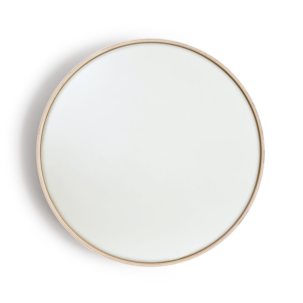 White Oak Wood Round Mirror by Saito Wood Co for Nalata Nalata silhouetted hanging against white