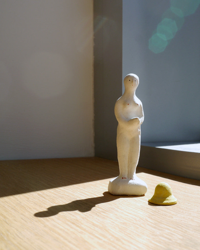 Figurine of Woman with Rain Hat (OUT OF STOCK)