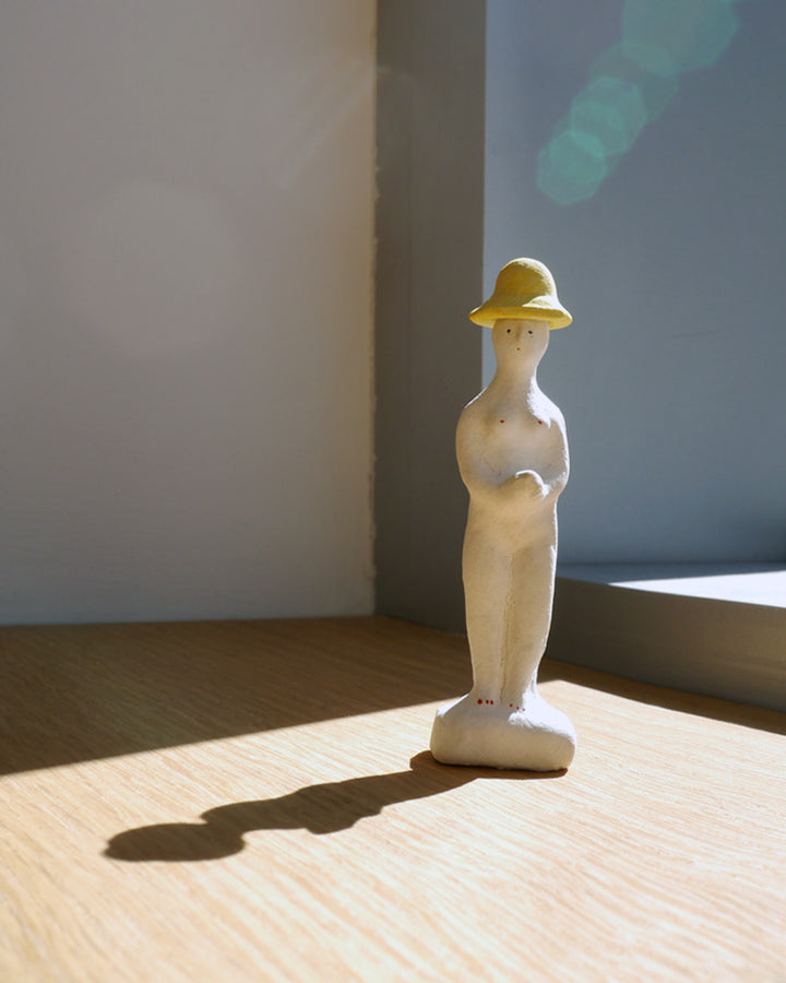 Figurine of Woman with Rain Hat (OUT OF STOCK)