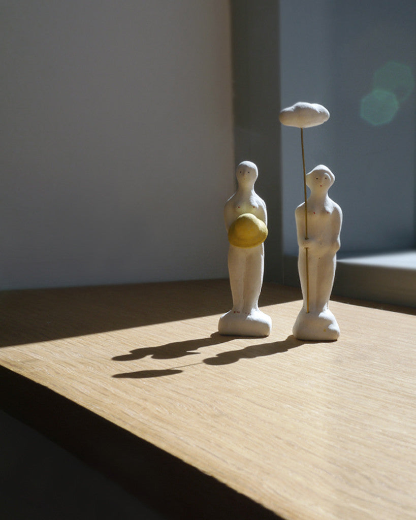 Figurine of Woman with Rain Hat (OUT OF STOCK)